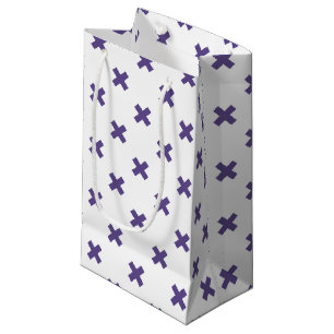 Ultra-violetkruisstiften op wit klein cadeauzakje