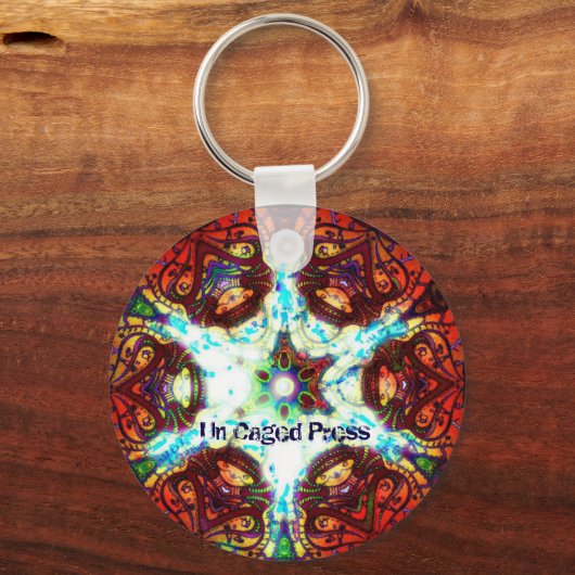 Un Caged Press Sleutelhanger (Voorkant)