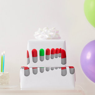 Unieke groene pil tussen rode capsules cadeaupapier