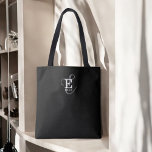 Unieke Stijlvolle Naam en Monogram Typografie Zwar Tote Bag<br><div class="desc">Een mooi canvas tas ontwerp met een stijlvolle weergave van jouw naam en monogram met klassieke series en een meer scripttypografie in een evenwichtige en symmetrische harmonie. De drie elementen gaan samen met een verfijnde harmonie en creëer je eigen persoonlijke branding logo. Hier afgebeeld met een chique zwarte achtergrond met...</div>