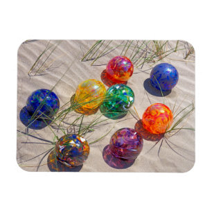 USA, Oregon. Colorful Glass Floats On Sand Dune Magneet