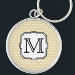 Uw brief. Aangepast monogram. Beige Polka Dot. Sleutelhanger<br><div class="desc">Witte en beige polka stippatroon. De zwarte brief van het initiaal van het monogram van de douane in een aardige doopvont,  voor u om in uw keus van brief of cijfer te veranderen. Dit ontwerp op het object is een plat afgedrukt afbeelding.</div>