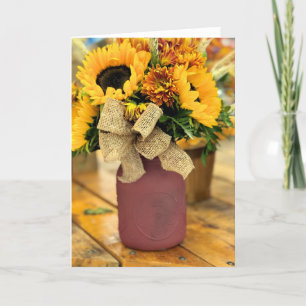 Vaas van zonnebloemen en moeders bedankkaart