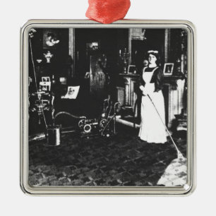 Vacuümreiniger op het werk metalen ornament