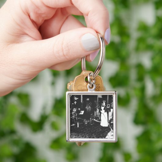 Vacuümreiniger op het werk sleutelhanger (Hand)