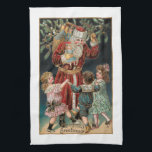 Vader Kerstmis met Dansende Kinderen & Mistletoe Theedoek<br><div class="desc">Jolly roodgeklede  kerstman met zijn zak cadeaus en holly met drie vrolijke kinderen die om hem heen dansen met maretak boven en gouden hoogtepunten. Achtergrondkleur is aanpasbaar.</div>