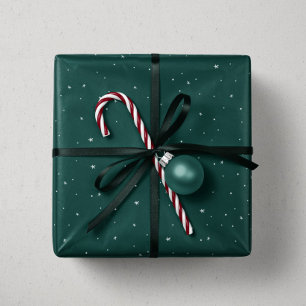 Vakanessterren en stippen met groene kerstmis cadeaupapier