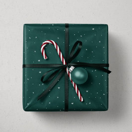 Vakanessterren en stippen met groene kerstmis cadeaupapier
