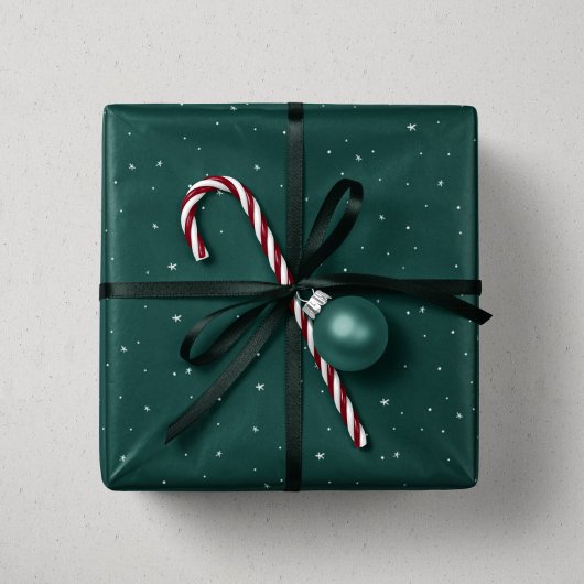 Vakanessterren en stippen met groene kerstmis cadeaupapier