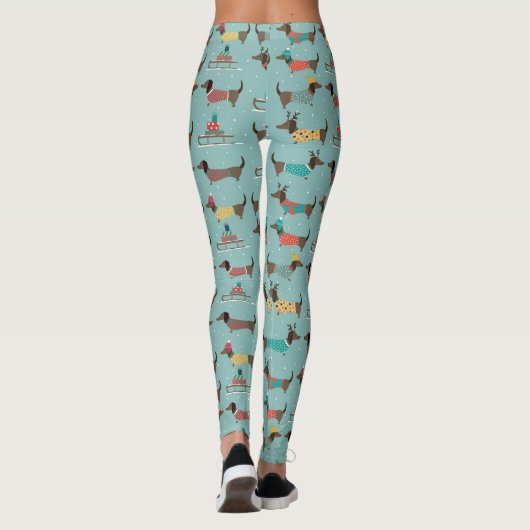 Vakantie teckels met geschenken en sleeën patroon leggings (Achterkant)