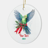 Vakantieparkiet en rood kerstlint keramisch ornament (Links)