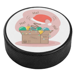 Vakkist met kerstversiering en kersthoed hockey puck