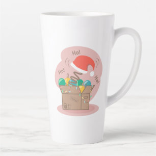 Vakkist met kerstversiering en kersthoed latte mok