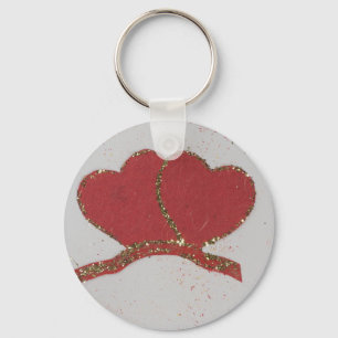 Valentijnse goudvonk met rood hart sleutelhanger