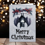 Vampire Bat Gothic Christmas Kaart<br><div class="desc">Omarm het vakantieseizoen met een vleugje gotische charme! Deze unieke kerstkaart is voorzien van een vampiervleermuis die aan een tak hangt en zijn eigen merk van donker feestelijk gejuich verspreidt. Deze kaart is de perfecte keuze voor iedereen die houdt van een spookachtige draai aan traditie. Stuur je warmste wensen met...</div>