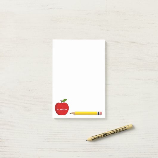Van het bureau van de leraar rode appel post-it® notes (Op bureau)