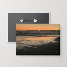 Van schemering tot schemering op het strand Foto a Button