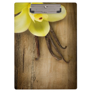 Vanilla Pods and Flower over Wooden Background Klembord