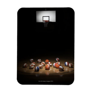 Veel basketballen die op de vloer rusten magneet