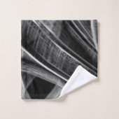 Veel gedraaid met grijze groeven op een donkere ac bad handdoek (Wasdoekje)