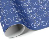 Veel witte fietspictogrammen op een blauwe achterg cadeaupapier (Rol Hoek)