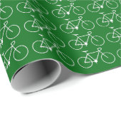 Veel witte fietspictogrammen op een groene achterg cadeaupapier (Rol Hoek)