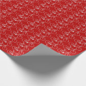 Veel witte fietspictogrammen op een rode achtergro cadeaupapier (Hoek)