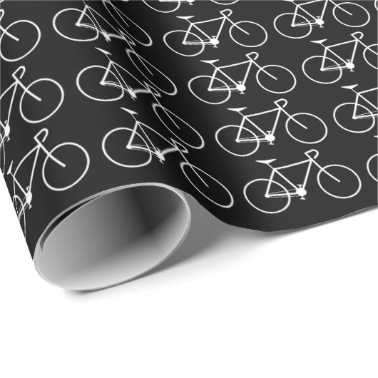 Veel witte fietspictogrammen op een zwarte achterg cadeaupapier (Rol Hoek)