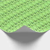 Veel zwarte fietspictogrammen op een groene achter cadeaupapier (Hoek)