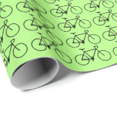 Veel zwarte fietspictogrammen op een groene achter cadeaupapier (Rol Hoek)