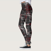 veenbes en wit op zwarte abstracte crisscross leggings (Links)
