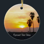 Venice Beach California Sunset Souvenir Ceramic of Keramisch Ornament<br><div class="desc">Dit fotografische afbeelding shows hoge palmbomen in silhouet die tegen een prachtige, levendige gele, gouden, oranje en rode zonsondergang boven de Stille Oceaan in Venetië Beach, Californië staan. Voeg facultatieve tekst of uw vakantiedata voor toe één van een soort uniek souvenir. Een ander origineel exclusief ontwerp van Sonja Quidama Afbeelding...</div>