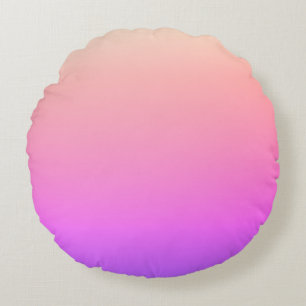 Verblekende perzik roze en paarse kleurrijke ombre rond kussen