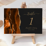 Verbrand Oranje goudgrijs huwelijk Kaart<br><div class="desc">De linkerrand van deze elegante moderne trouwtafel-nummerkaart is voorzien van een verbrande oranje waterverf aan de rand van de afgrond,  die met faux goudglitter is bedekt. De aanpasbare tekst combineert goudkleurige handteksten,  en cursieve en copperplate doopvonten op een donkere off-zwarte achtergrond.</div>