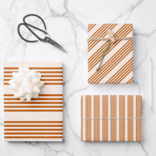 Verbrandend sinaasappel en beige vijf strips inpakpapier vel