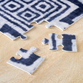 Verdraaide indigo geruite gestructureerde achtergr legpuzzel (Zijkant)