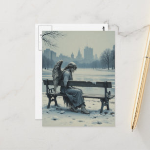 Verdrietige engel zittend op een parkbank briefkaart