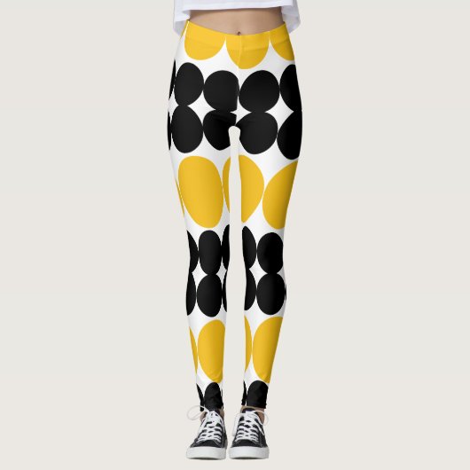 Verduisterende cirkels, geel en zwart patroon ontw leggings (Voorkant)