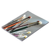 Verfborstels drogen in het zonlicht notitieboek (Linkerzijde)