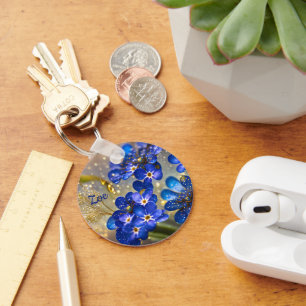 Vergeet me-niet bloem met gouden accenten sleutelhanger