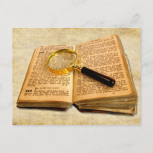 Vergrootglas en oud boek briefkaart