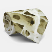 Vergrote poreuze textuur van het menselijke Hip Bo Stropdas (Opgerold)