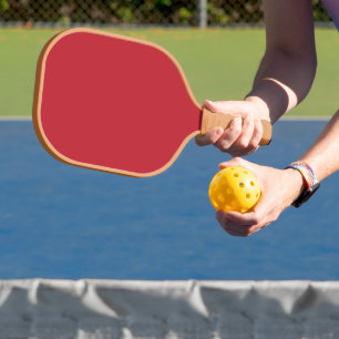 Verhoog uw ontwerp met een rode achtergrond en wit pickleball paddle