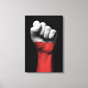 Verhoogde uitgelijnde vuist met Poolse vlag Canvas Afdruk