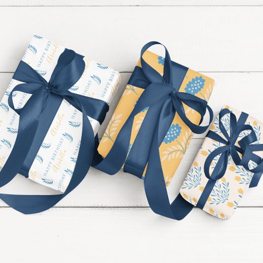 Verjaardagsblauw en oranje bloemige inpakvellen inpakpapier vel