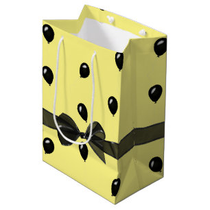 Verjaardagsboog en zwarte ballonnen medium cadeauzakje