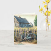 Verlaten oude fiets op rustieke hek kaart (Gele Bloem)