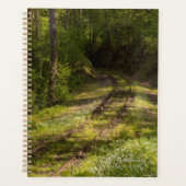 Verlaten spoorlijn in een bos planner (Voorkant)