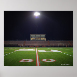 Verlicht Amerikaans football 's nachts Poster