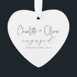 Verloving Keepsake Heart Ornament<br><div class="desc">Een stijlvol verlovingen ornament met typografie die de namen van het paar, de datum van het verloving en het woord in het moderne schrift benadrukt. Ontworpen op een eenvoudig wit hart met een tijdloos zwart lettertype, maakt deze aandenken een prachtig geschenk voor pas verloofde koppels of een gekoesterde toevoeging aan...</div>